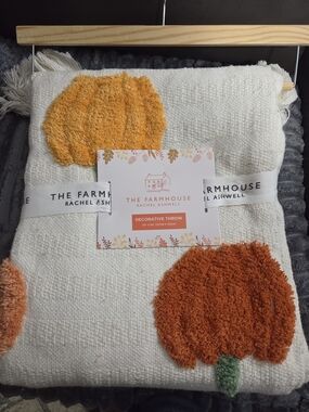 The Farmhouse Rachel Ashwell Cream Throw with Orange Pumpkin Motifs
